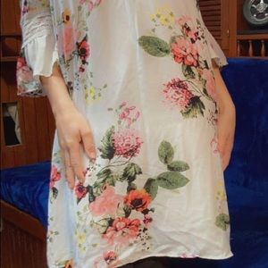 White soft off the shoulder spring dress.